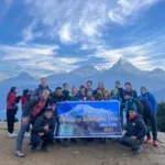 trekking group from germany on the top of the poonhill viewpoint alt.3210m from sea level