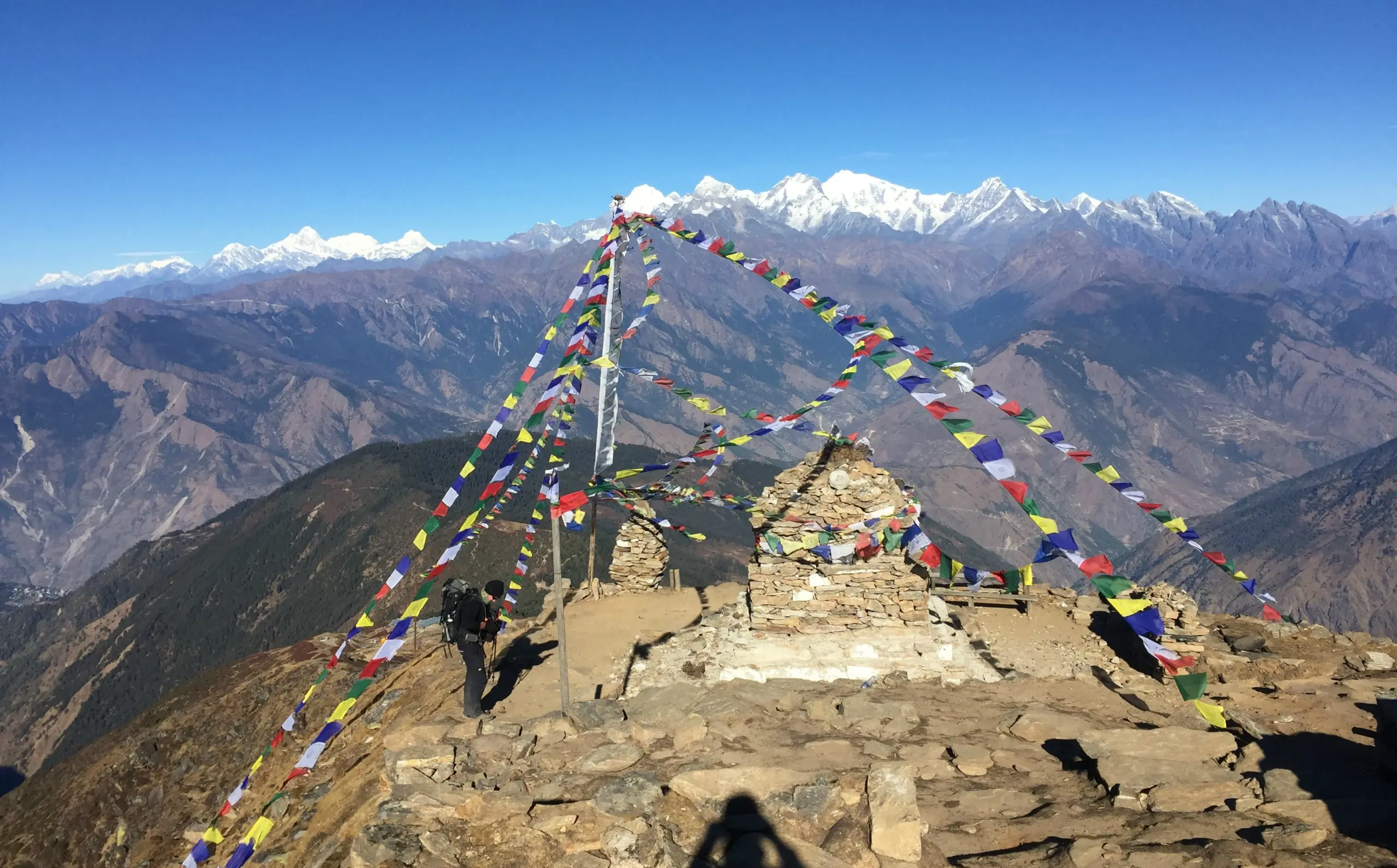 Why Autumn 2026 Is the Best Time for Trekking in Nepal 5 Mountain peak with colorful prayer flags